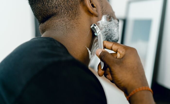 Person using a razor designed for shaving, demonstrating alternate use of products.