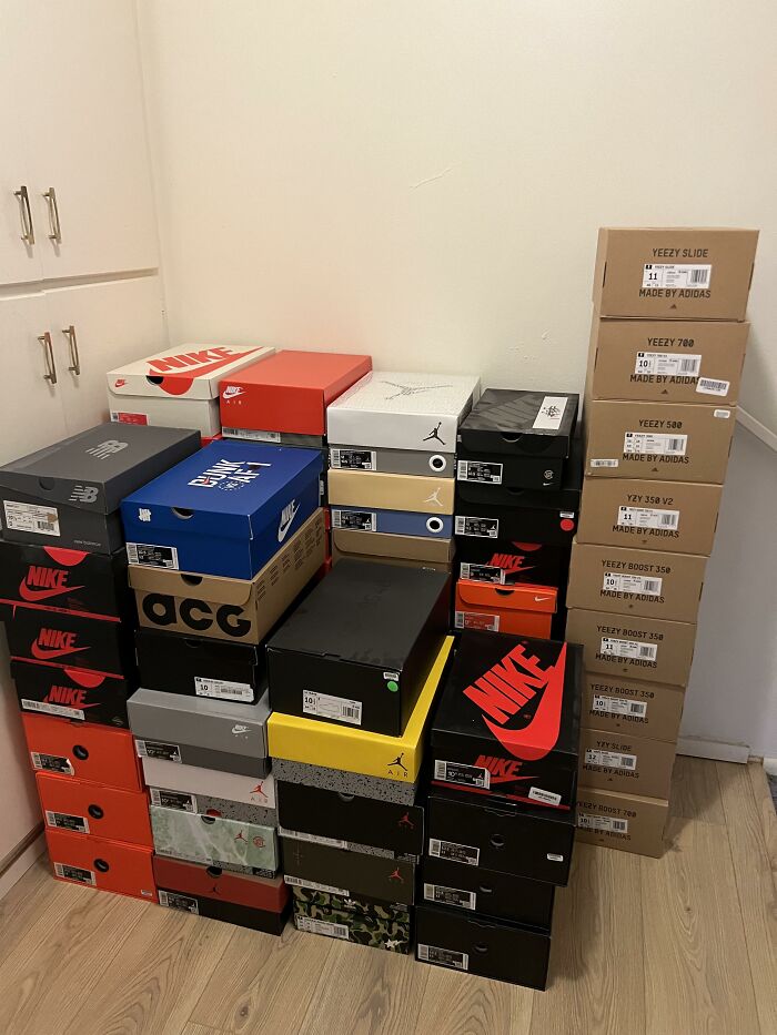 Stacked shoeboxes for brands like Nike and Adidas, potentially repurposed for innovative uses beyond storing shoes.