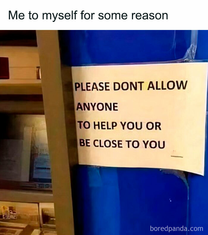 Sign reading "PLEASE DON'T ALLOW ANYONE TO HELP YOU OR BE CLOSE TO YOU," highlighting introvert humor.