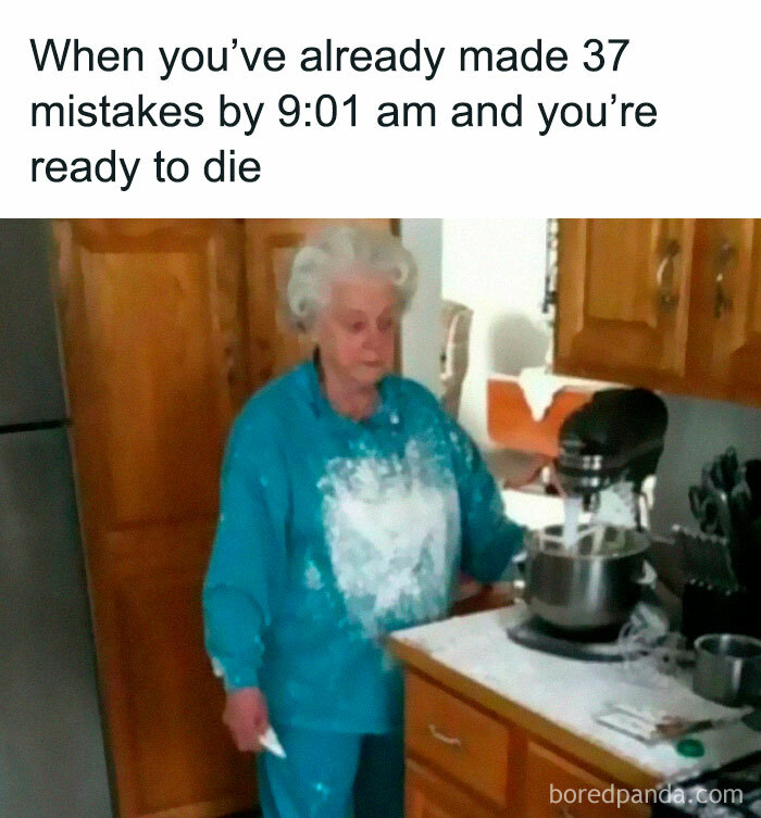 Elderly woman in kitchen with flour on her sweatshirt, embodying a funny meme about having a bad day.