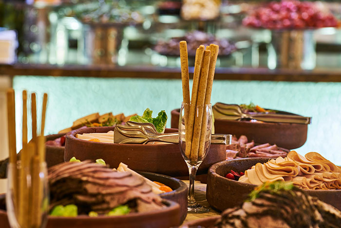 Buffet with various meats and breadsticks from restaurants that don’t exist today.