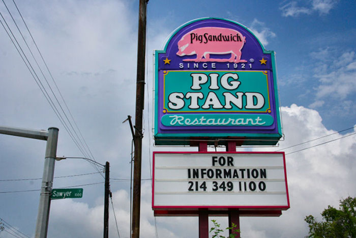 Vintage Pig Stand restaurant sign with contact info, an example of restaurants that don’t exist today.