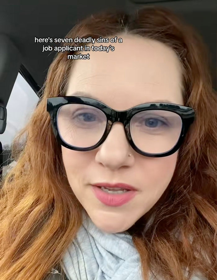 Woman in glasses sharing r&eacute;sum&eacute; writing insights for 2025 mistakes.