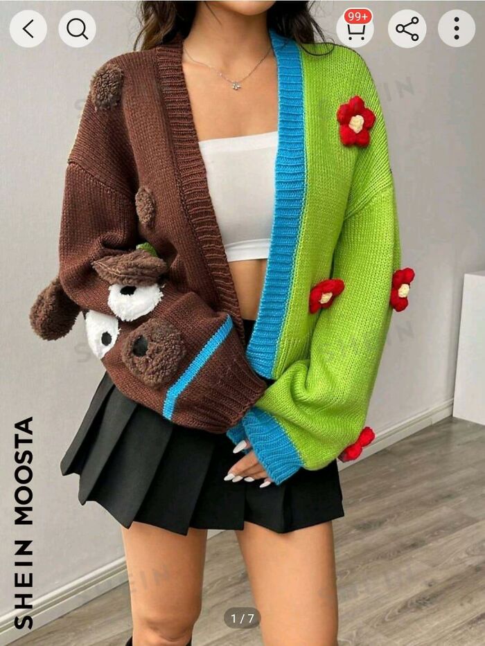 Colorful sweater with mismatched patterns and 3D bear design, showcased in a fashion disaster photo.
