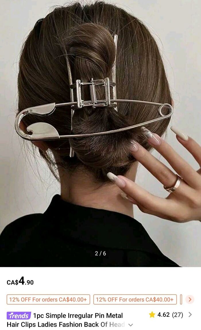 Fashion disasters: Hair styled with large metal safety pin clip in a bun.