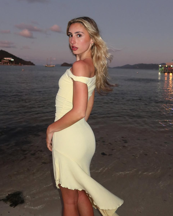 Person in a yellow dress on a beach at sunset, related to Photoshop fail discussion.