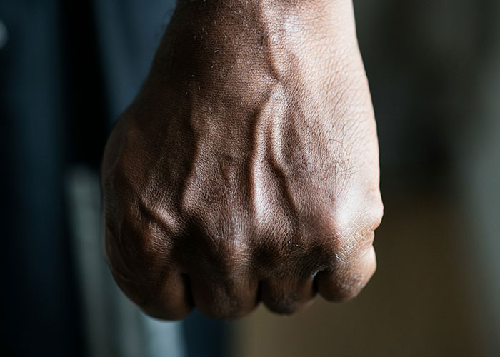 A clenched fist, suggesting a tense or frightening moment.