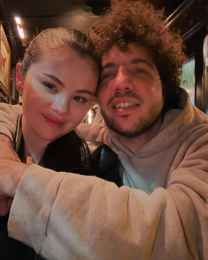 Selena Gomez and Benny Blanco smiling for a selfie.