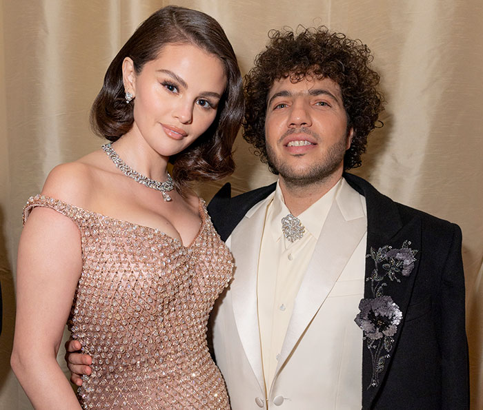 Selena Gomez's fianc&eacute; in elegant attire, smiling at an event, highlighting his views on treating women.