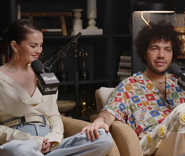 Selena Gomez's fianc&eacute; shares his views on treating women, speaking into a microphone, dressed casually.