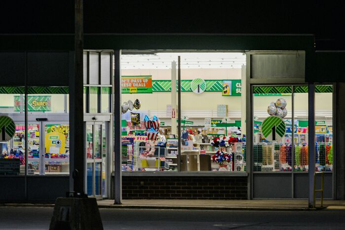 Storefront window displaying various colorful items, combating common stereotypes through diverse product offerings.