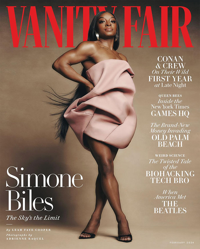 Simone Biles posing in a stylish pink dress on Vanity Fair cover, symbolizing her success beyond gymnastics.
