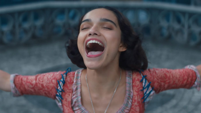 Actress joyfully stretching arms, highlighting changes in new Snow White remake.