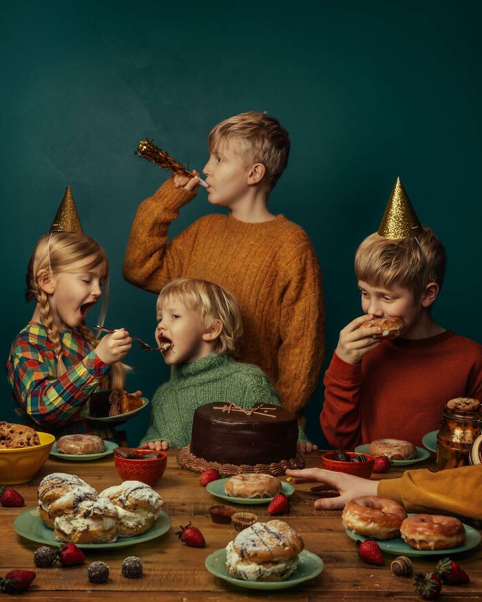 Children celebrating with sweets and party hats, capturing the magic of childhood.