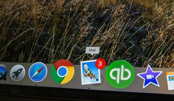 Icons on a computer dock with a mail app notification, illustrating simple approaches to improve life.