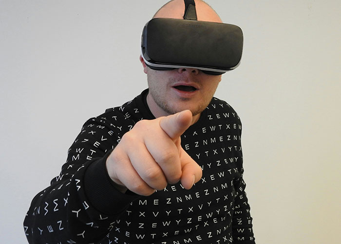 A person wearing a VR headset in a gym-themed setting, pointing forward, illustrating bizarre gym activities.