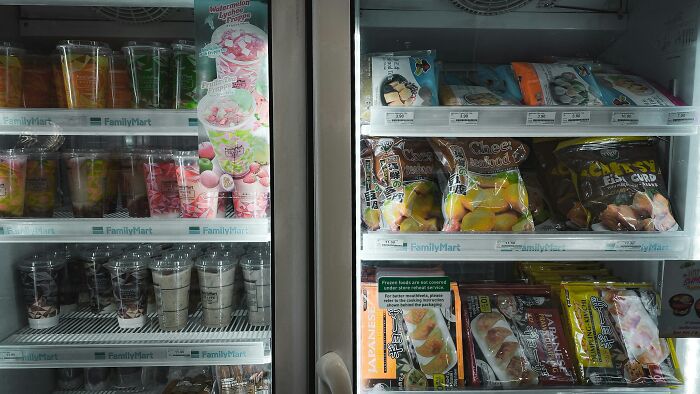 FamilyMart freezer displaying various frozen snacks and desserts, highlighting alternatives to frugal hacks.