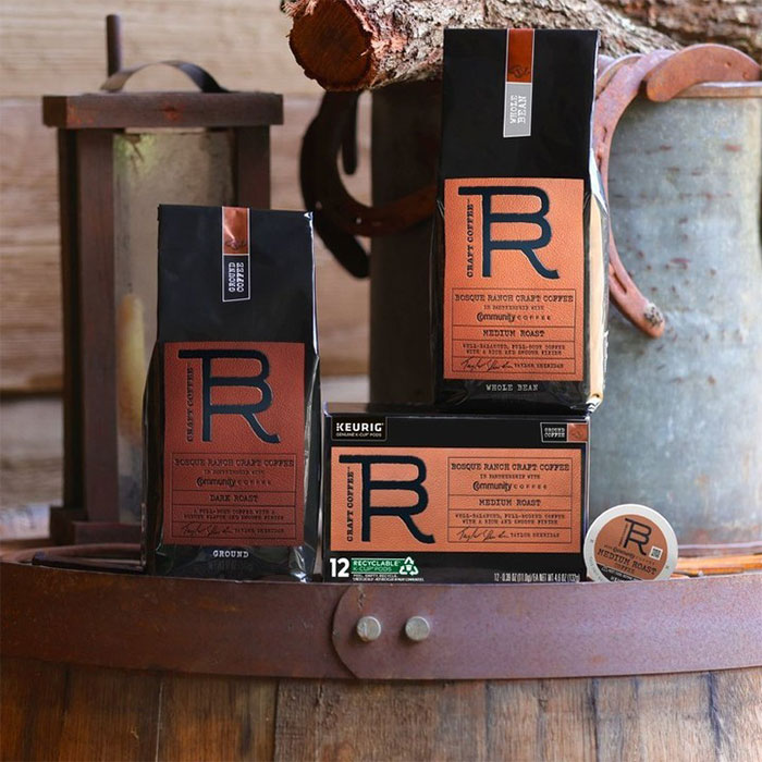 Coffee products on a rustic barrel, highlighting Taylor Sheridan&rsquo;s growing influence.