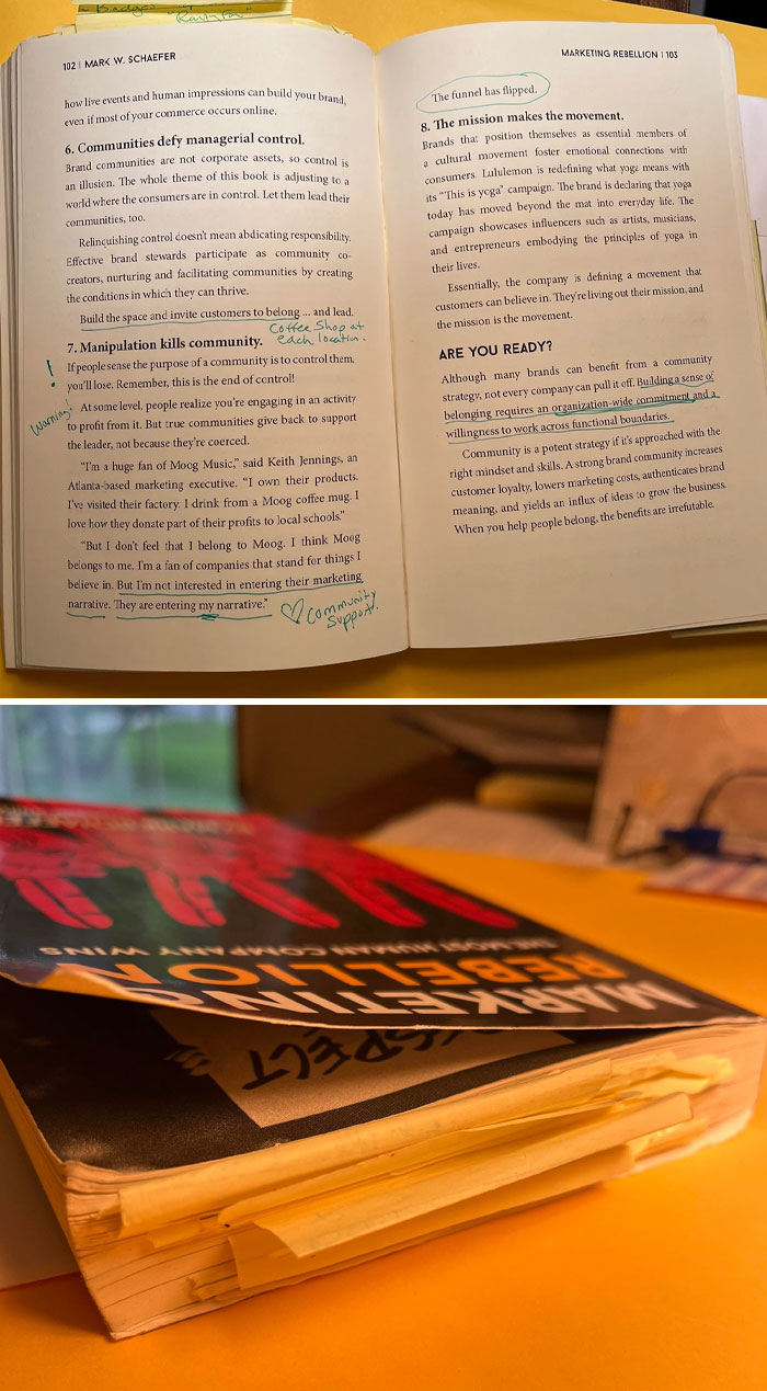 Open book with underlined text and notes, highlighting community and brand management.