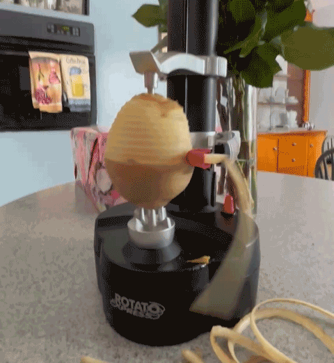 Automatic potato peeler in action, revolutionizing kitchen efficiency with ease.
