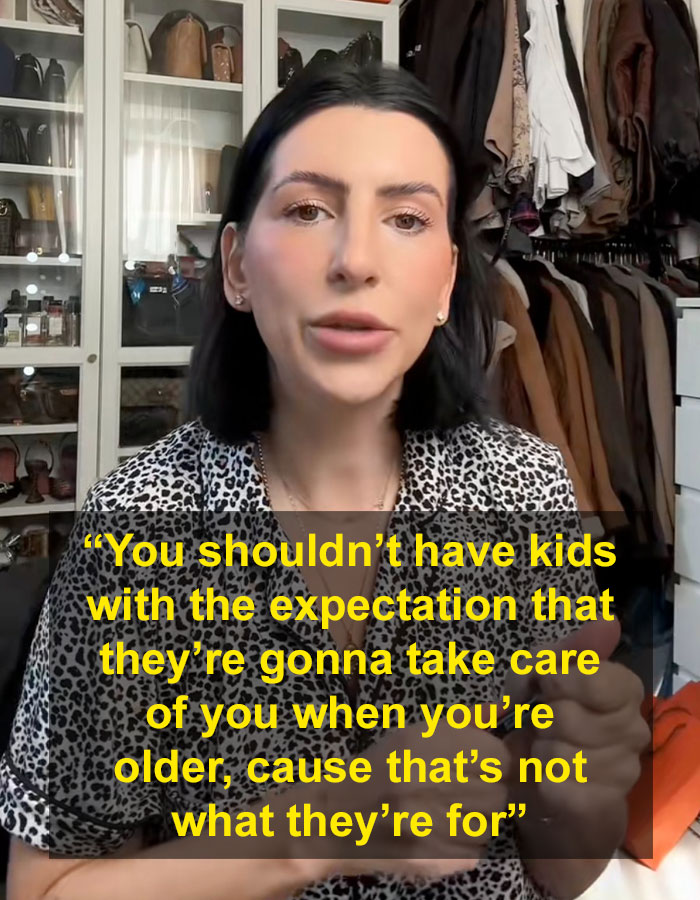 Millennial woman discussing child-free lifestyle choices in a walk-in closet with clothes and bags.