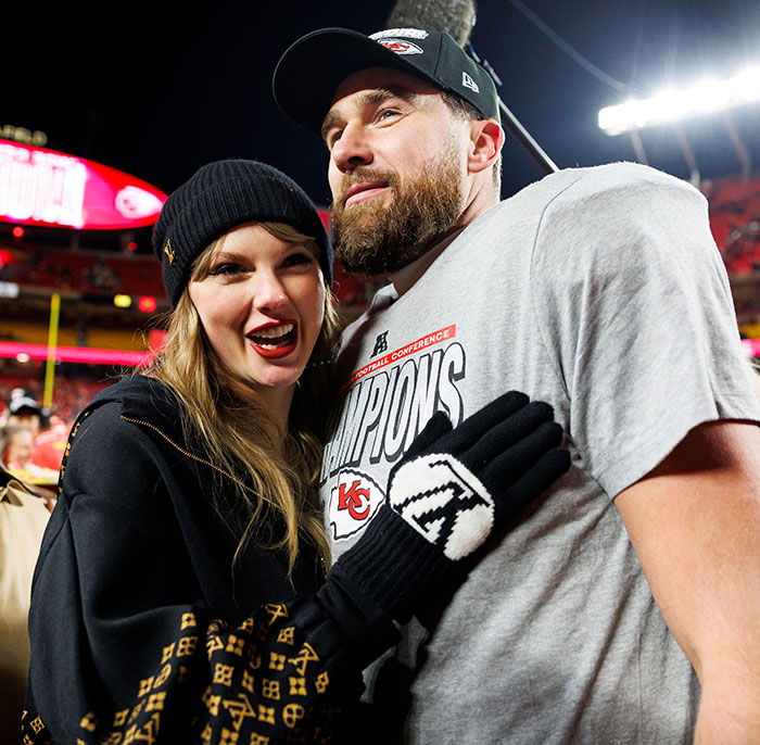 Taylor Swift and Travis Kelce at night, with her in a stylish beanie, fans intrigued by celebrity appearance.