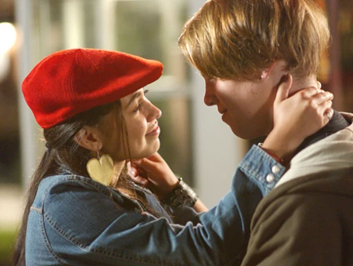 Two TV characters in an intimate moment, showcasing TV couples with less chemistry.