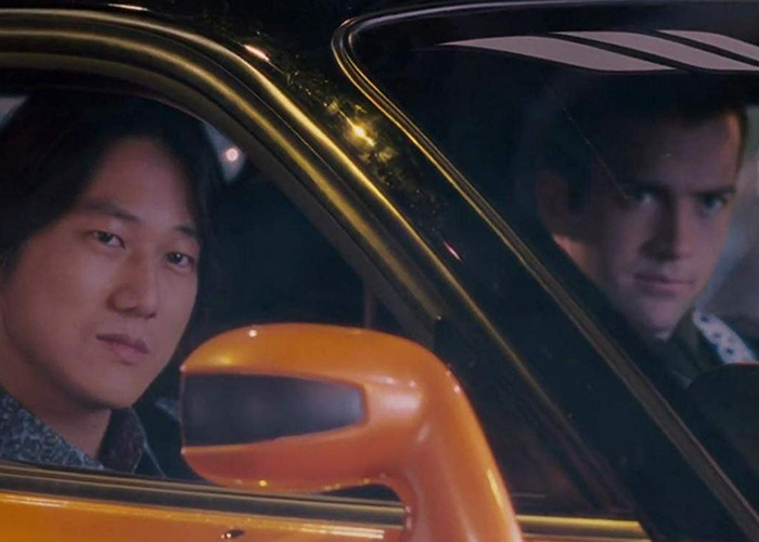 Two individuals sitting inside a parked car at night, highlighting unsettling facts shared by an influencer.