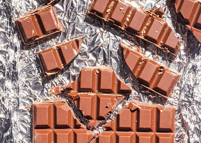C*****d chocolate bars on foil, highlighted by influencer's unusual facts.