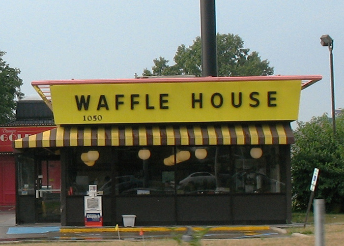 Waffle House exterior with yellow sign and striped awning, related to unsettling facts shared by influencer.