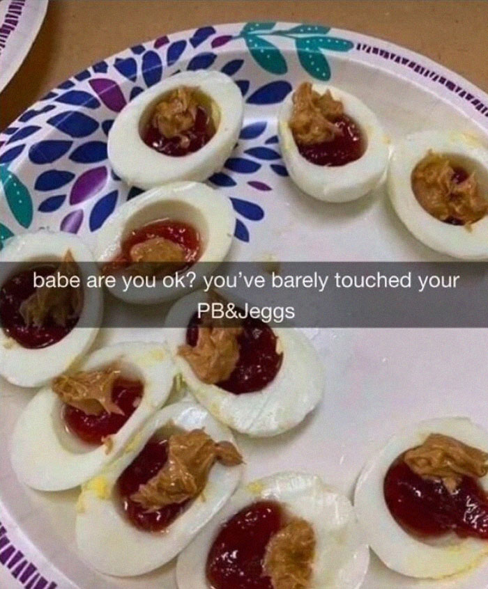 Plate of eggs topped with peanut butter and jelly as a funny meme.