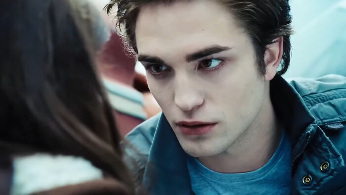 Person with focused expression in a blue shirt and jacket, illustrating a moment often criticized online.