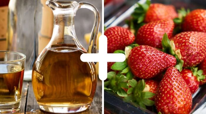 Wine vinegar in a glass jug and fresh strawberries side by side, illustrating weird food combos.