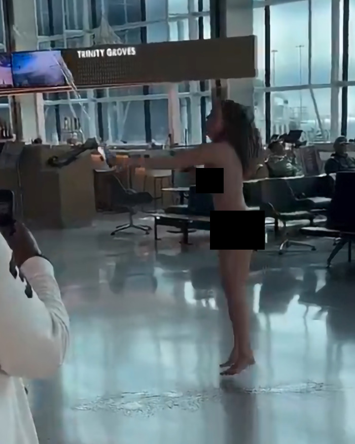 A woman running in an airport, captured in a dramatic scene.