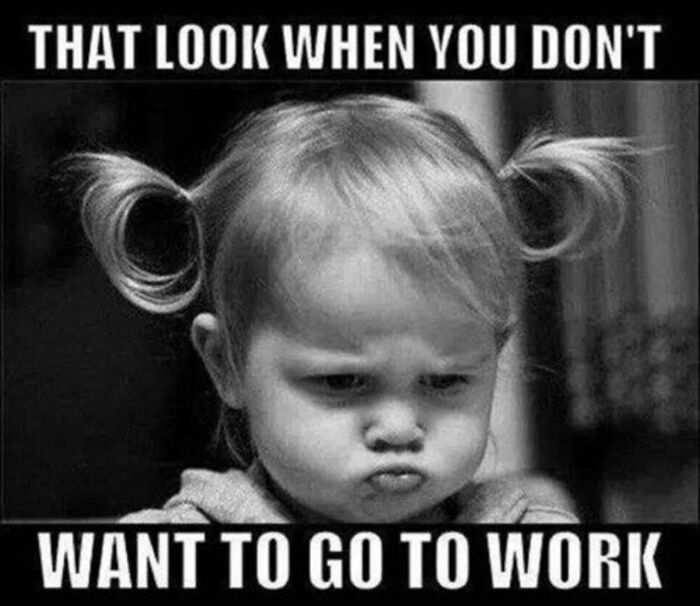 Toddler with pigtails making a funny face, capturing work frustration and reluctance.