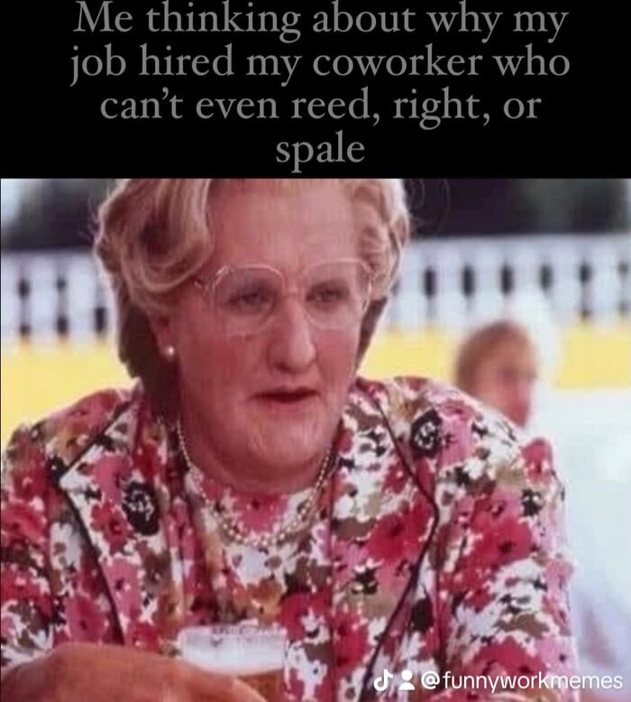 Person in floral outfit holding a drink, humorously pondering coworker's skills. Funny work memes theme.