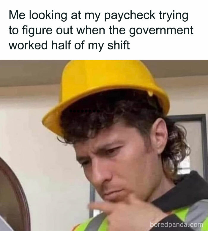 Man in a hard hat looking puzzled at his paycheck, funny work meme on government taxes.