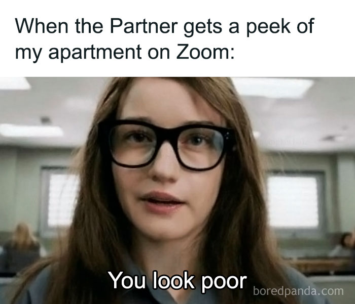 Woman with glasses in Zoom call meme, humor about work-related apartment reveals.