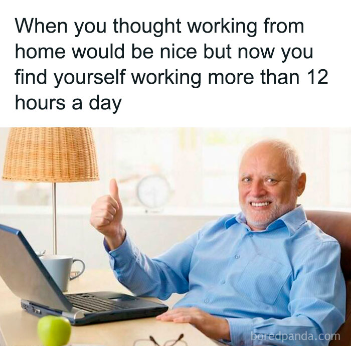 Elderly man smiling and giving thumbs up while working from home on a laptop. Work-related humor about long hours.