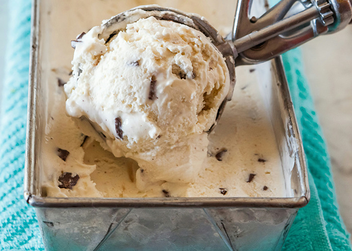 Ice cream with chocolate chunks in a metal container, representing unconventional diet choices.