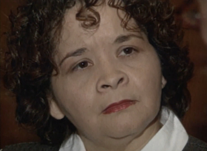 Woman involved in pop star Selena's assassination, facing parole denial, looking serious.
