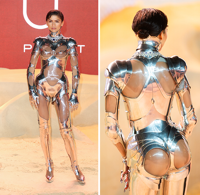 Celebrity in a futuristic metallic outfit on the red carpet, embodying fashion's challenges.