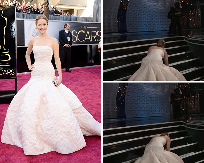 Celebrity falls on stage in elegant gown, symbolizing suffering for fashion at a red carpet event.