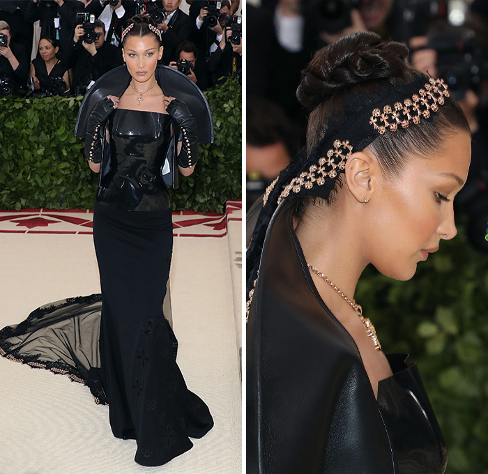 Celebrity in a dramatic black gown on the red carpet, exuding elegance and fashion-forward style.