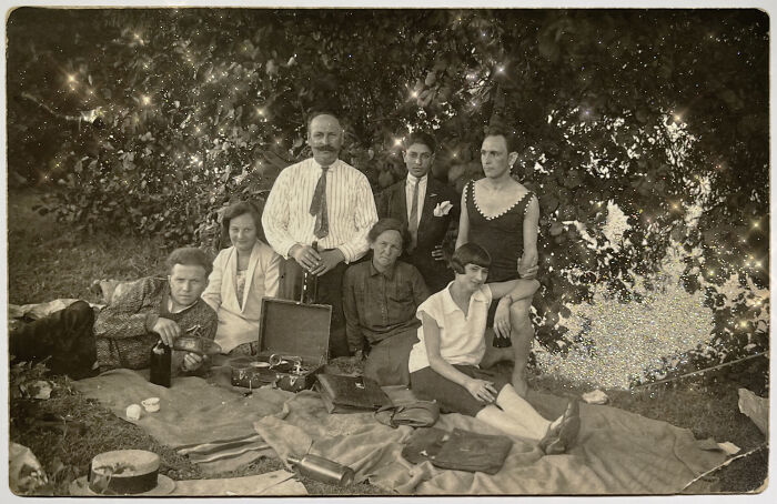 Vintage photo of a family picnic under a tree, capturing a moment of love without boundaries in 'An Impossibly Normal Life'.