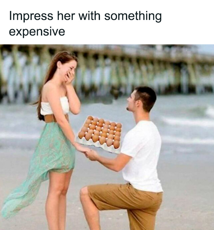Man humorously proposing with eggs on a beach, captioned “Impress her with something expensive.”