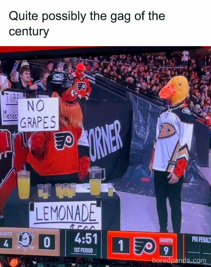 Hockey mascots share a humorous moment with lemonade stand during game, offering laughs for a boring week.