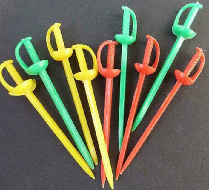 Colorful plastic sword cocktail picks from the past.