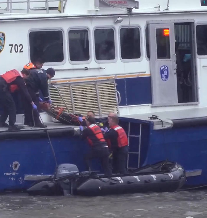 Rescue crew assists after NYC helicopter crash, baffling netizens.