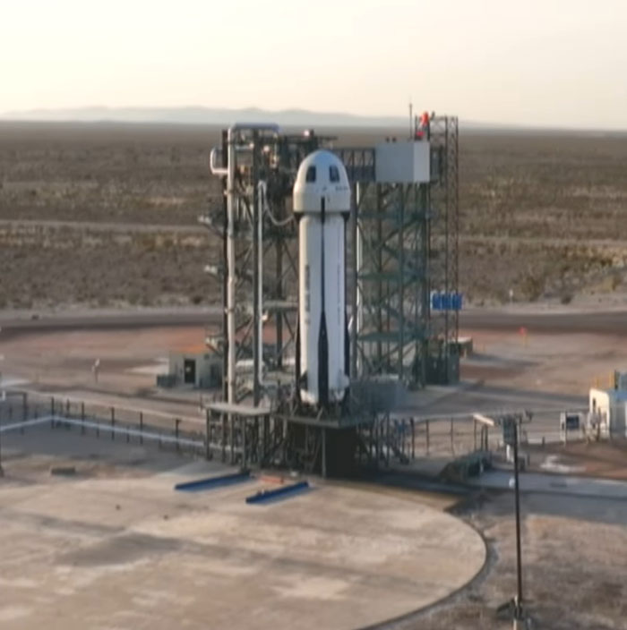 Rocket launch pad set for launch against a desert backdrop, highlighting massive support concept.